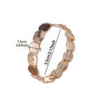 Uma Brincadeira de Punho Elástica Geométrica Estilo Boho, Projetada para Mulheres, Apresentando um Pulseira Dourada Trendy Feita de Liga de Zinco com um Processo de Revestimento Fino. O Seu Design Minimalista Torna-o Perfeito para Uso Diário, Festas de Da